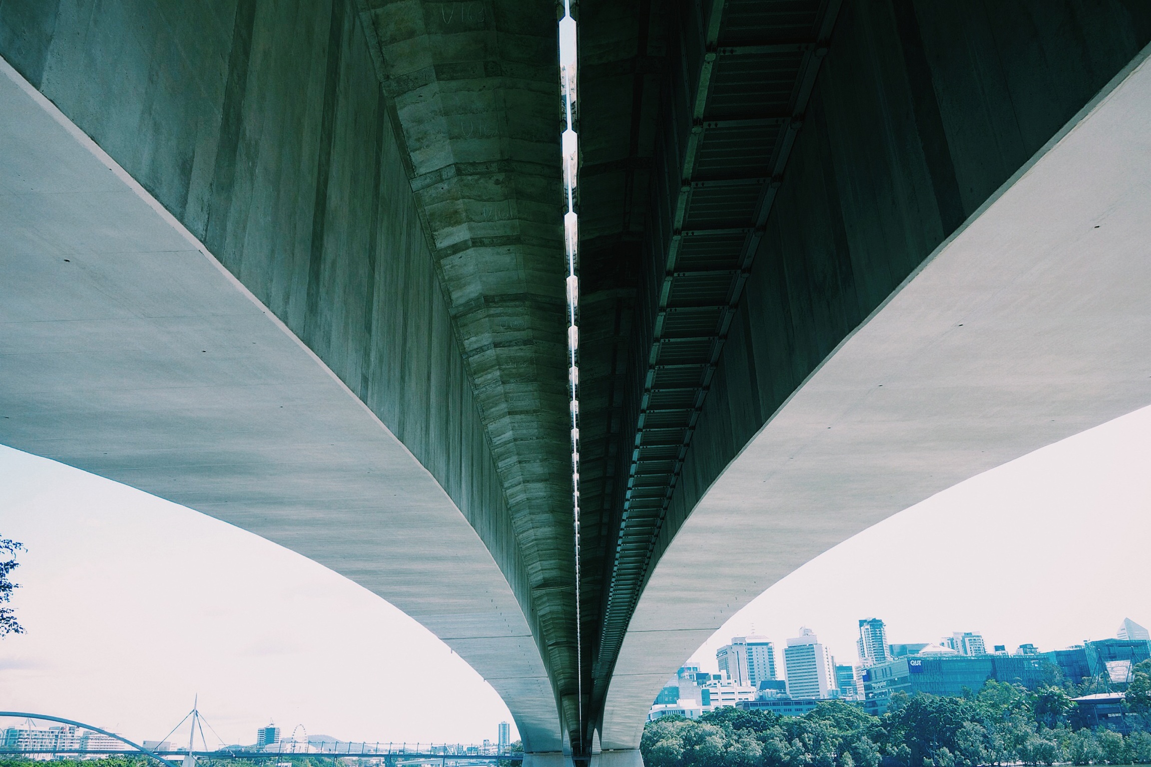 Metal city skyline with a bridge connection above