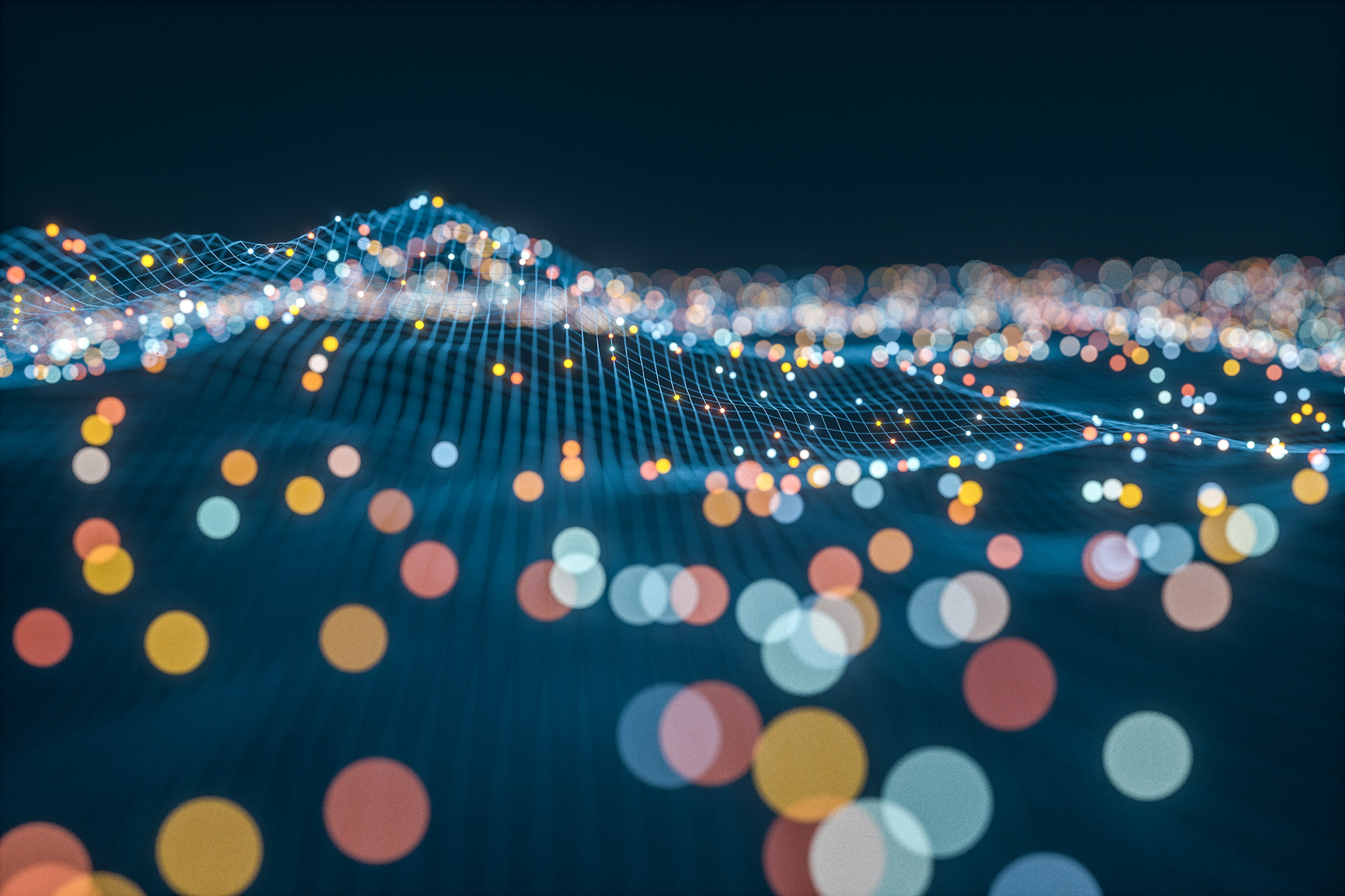 tiny colored balls floating in a blue grid