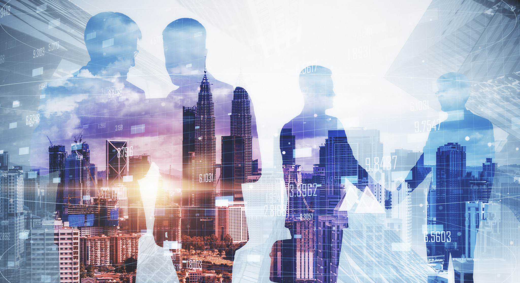 A group of business professionals shown in silhouette against a modern city skyline