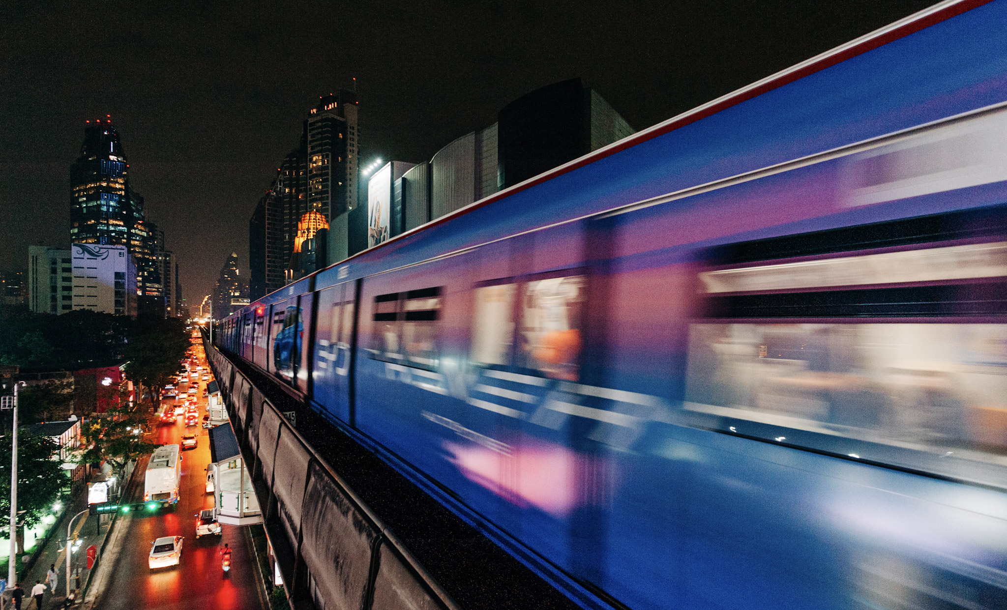 Modern train moving through a major Asia Pacific city at night, representing digital transformation and market growth in the APJ region