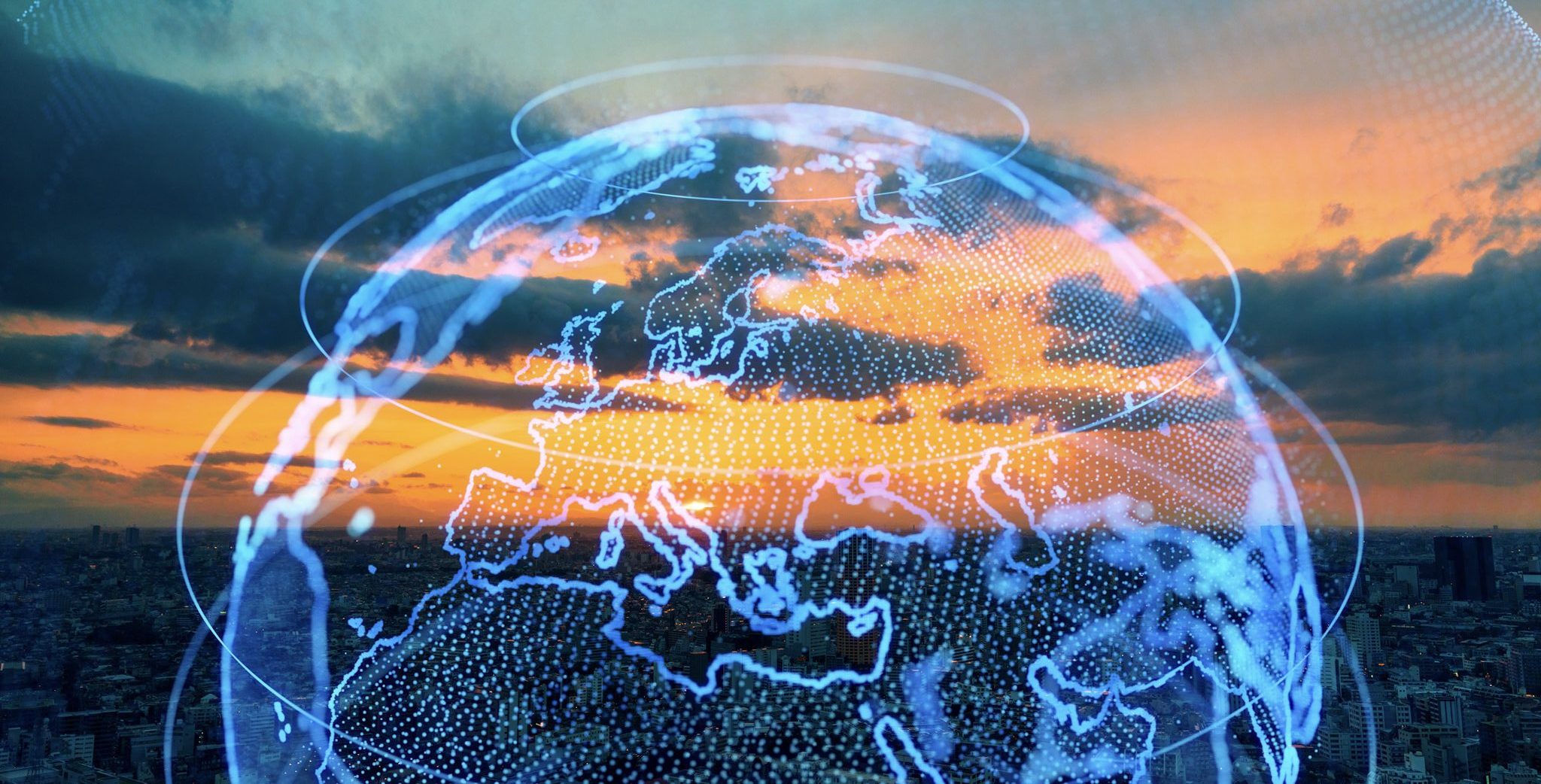 Digital globe overlay against a sunset sky above a city.