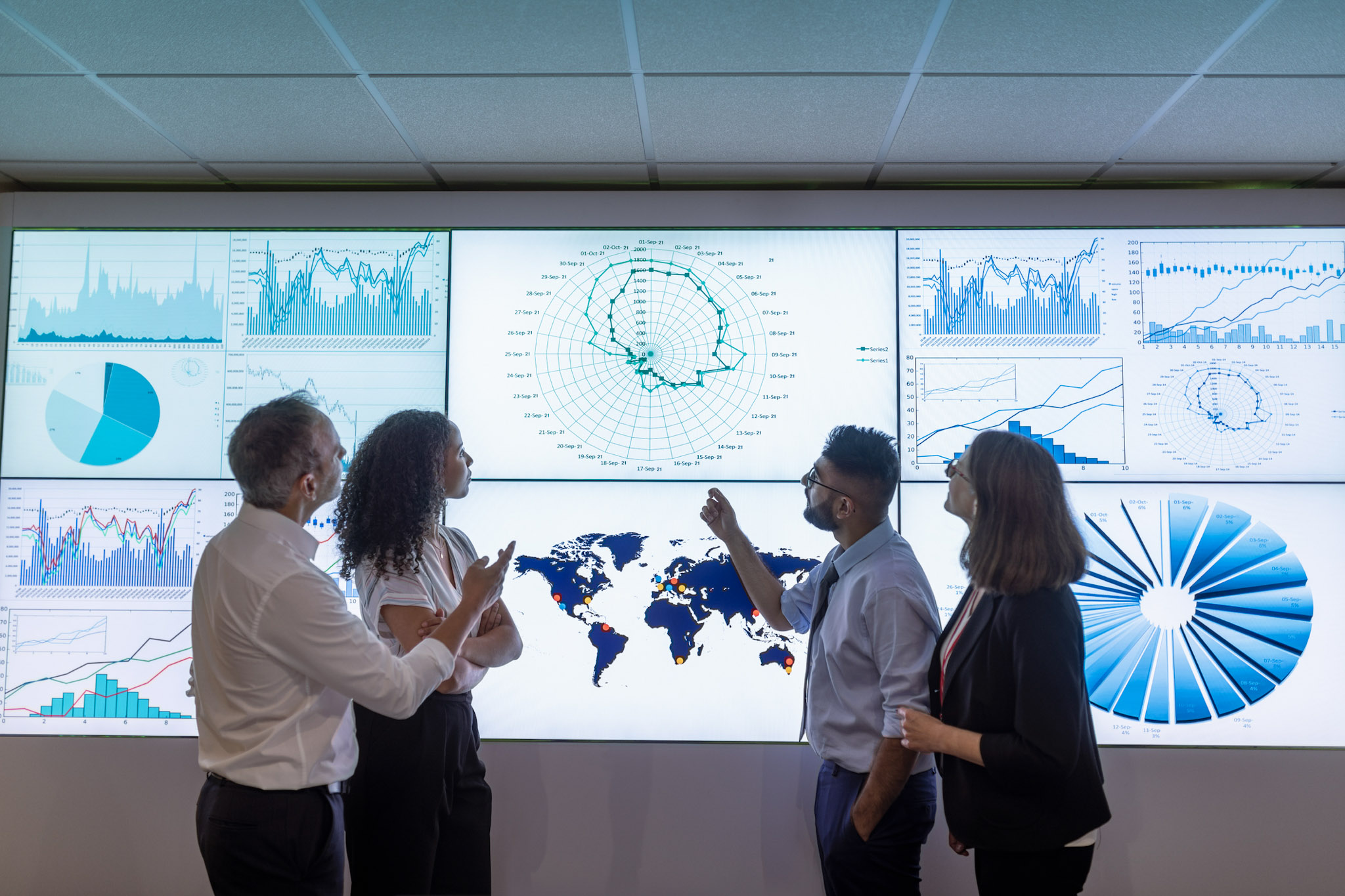 Business professionals reviewing analytics dashboards and cloud infrastructure performance metrics to drive partner ecosystem growth and customer outcomes
