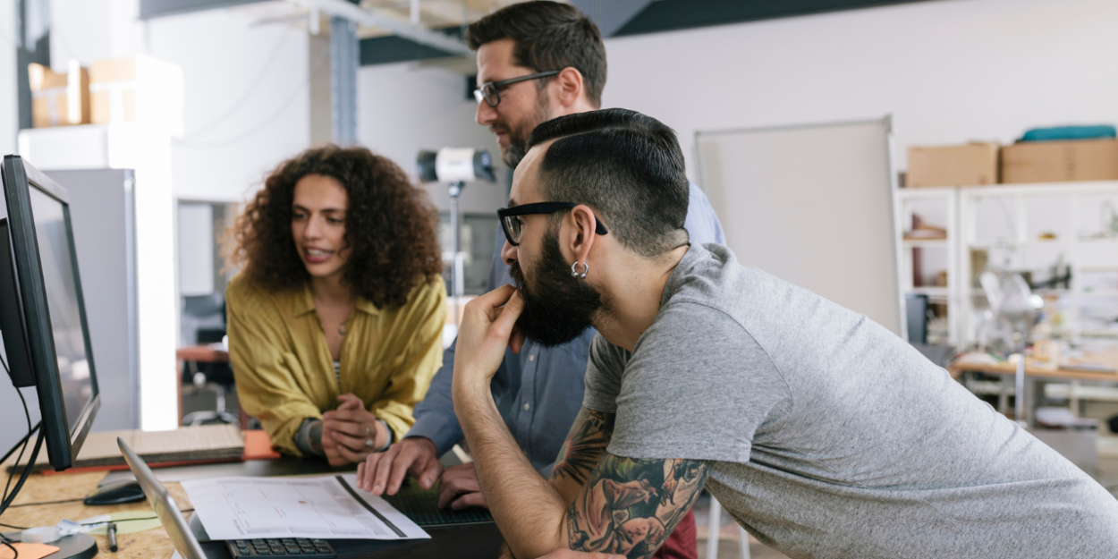 people gathering around computer