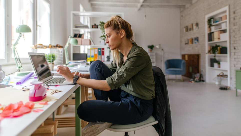 Woman sitting at computer.