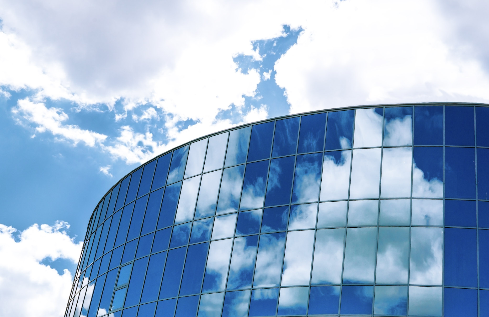 Glass window building with clouds