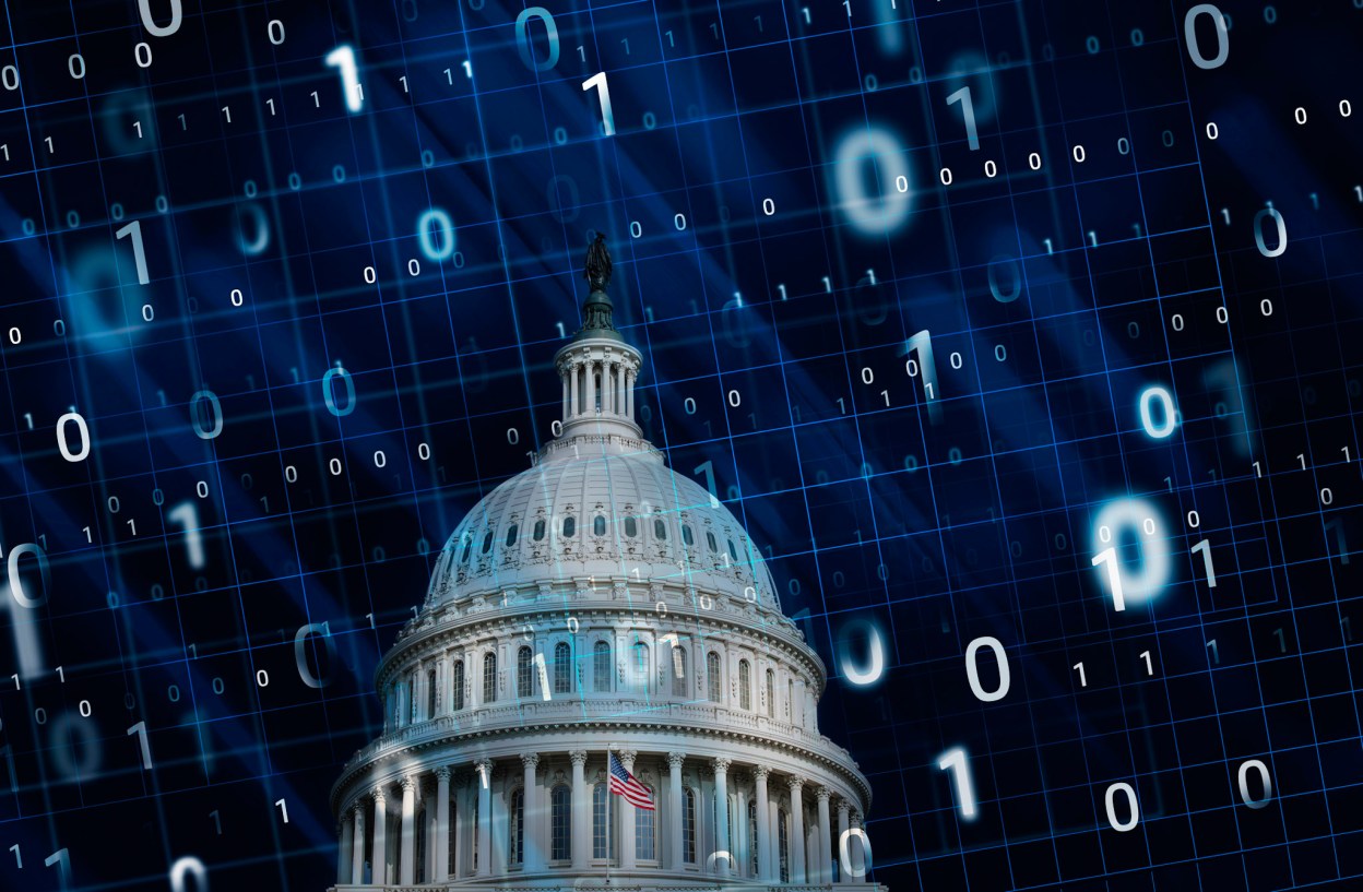 Digital illustration of the U.S. Capitol overlaid with binary code, symbolizing federal AI innovation, cybersecurity, and private cloud infrastructure.