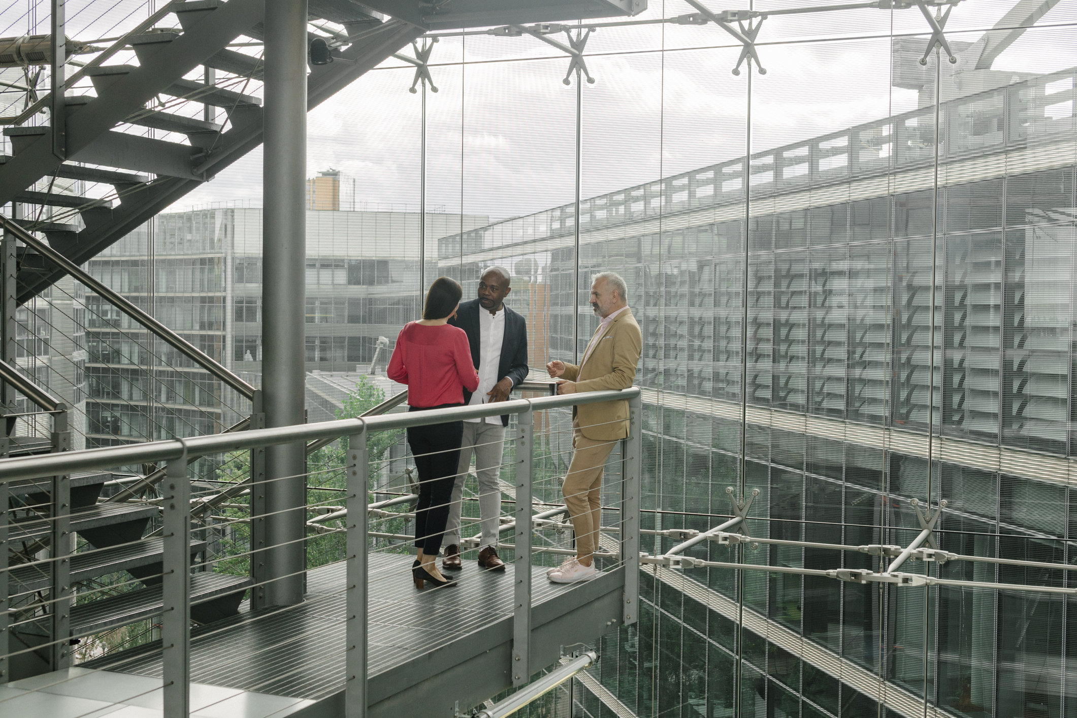 Business leaders meeting in a modern office building, representing enterprise modernization, private cloud adoption, and AI transformation across Asia Pacific and the Middle East.